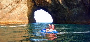 Couple jet-skiing, Hole in the Rock Bay of Islands