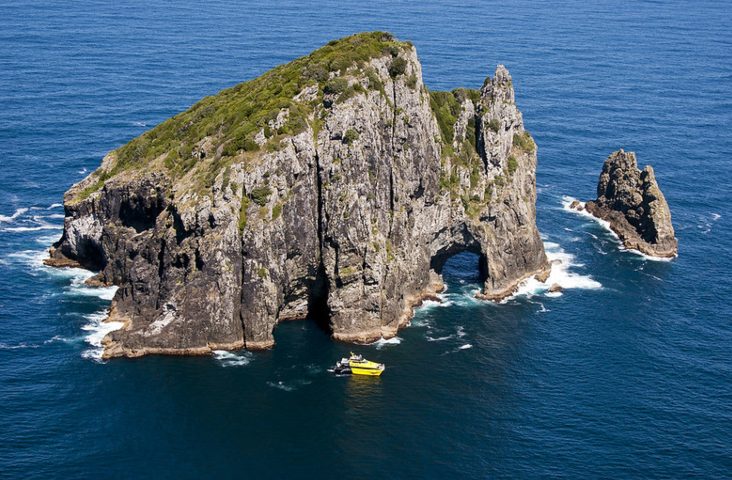 Sky View of Rock with Hole in Ocean - Discover The Bay Cruise - Image 3